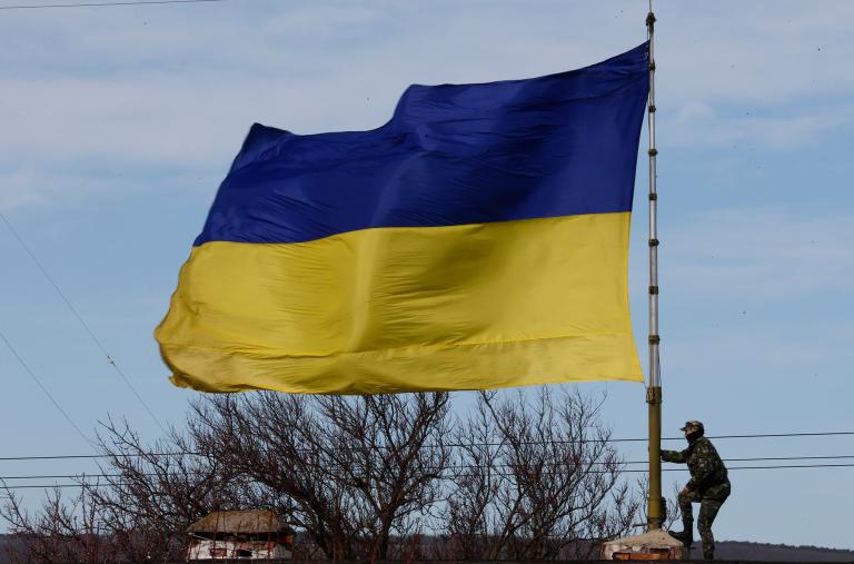 A Ukrainian flag flies at a naval base in Crimea in 2014 - source: Reuters