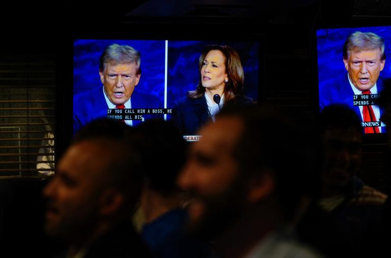 People watch the September 10, 2024 debate between presidential candidates Donald Trump and Kamala Harris - source: Reuters