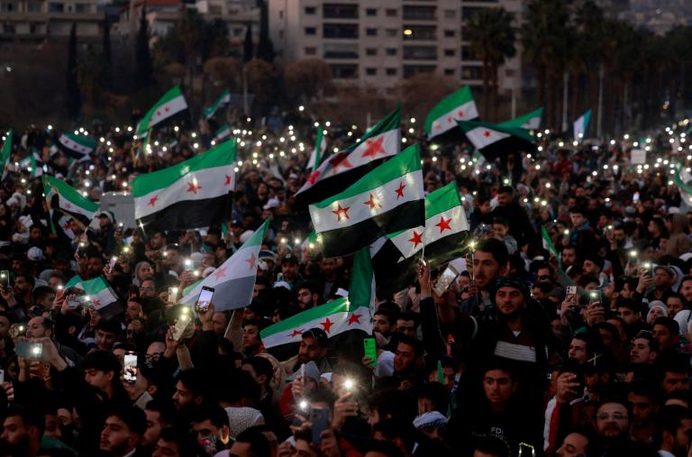 Syrian civilians celebrate the fall of the Assad regime in downtown Damascus in December 2024 - source: Reuters