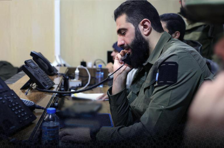 Syrian rebel leader Abu Mohammed al-Jolana speaks on the phone during the campaign to take Damascus in December 2024 - source: Reuters