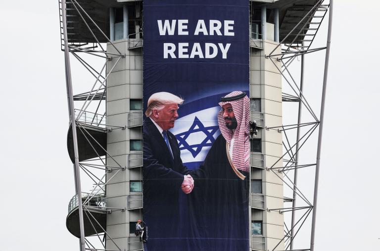 A billboard promoting a regional peace deal hangs in Ramat Gan, Israel, in February 2025 - source: Reuters