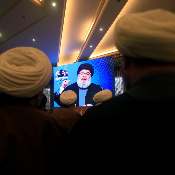 Photo of Lebanese Hezbollah leader Hassan Nasrallah onscreen while addressing a 2017 event.