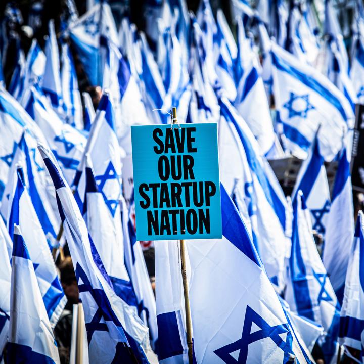 Protesters wave flags and placards in front of the Knesset to demonstrate their opposition to judicial reforms proposed by the coalition government of Israeli Prime Minister Netanyahu - source: Reuters