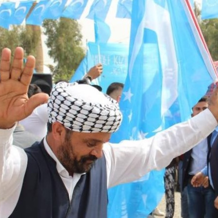 Iraqi Turkmen man with a Turkmen flag