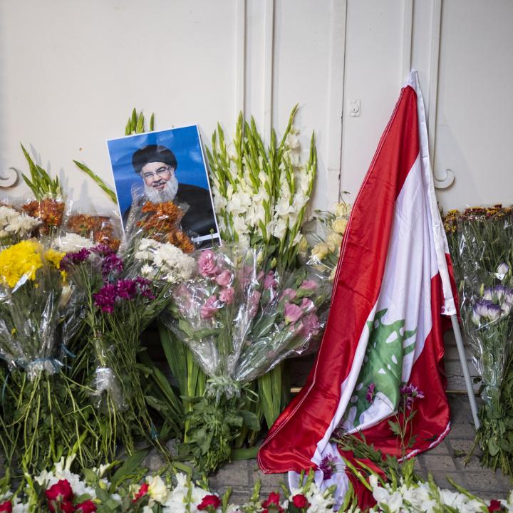 Flowers and a portrait of Hassan Nasrallah at a memorial to the slain Hezbollah leader in Beirut - source: Reuters