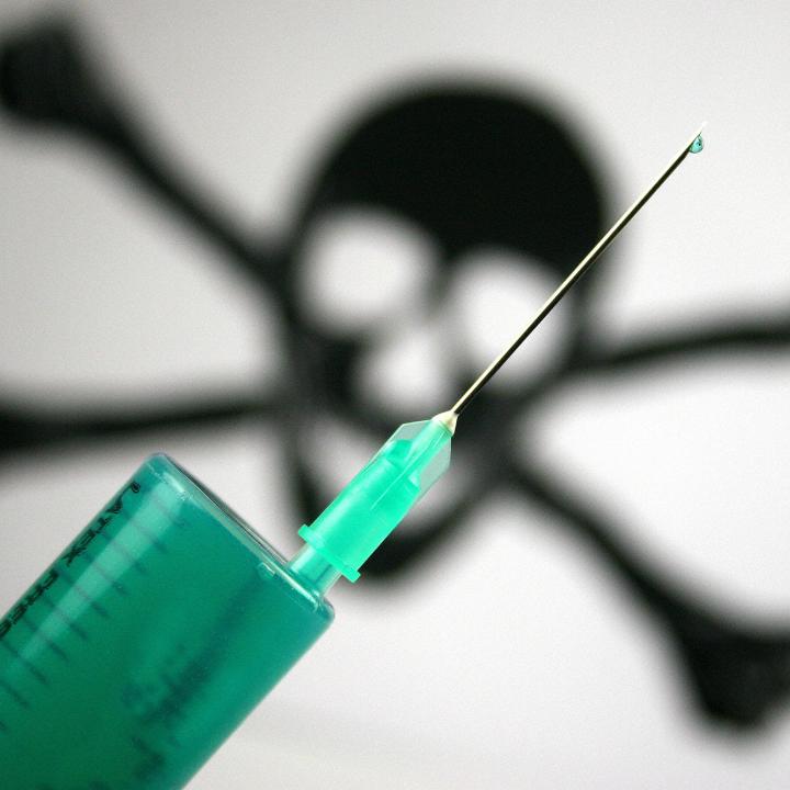 A photo illustration of a hypodermic needle and a poison symbol - source: Reuters