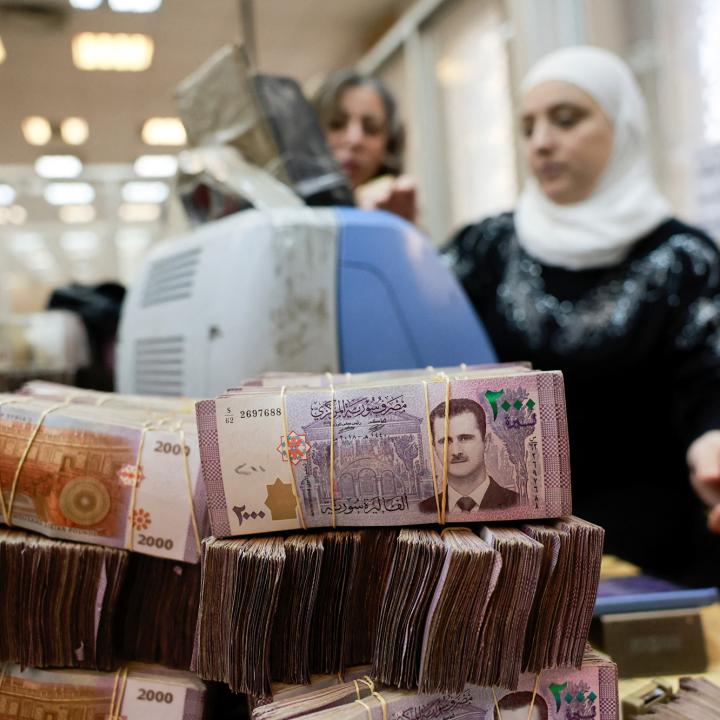 Workers package Syrian pound currency notes at the Syrian Central Bank in Damascus following the fall of the Assad regime in December 2024 - source: Reuters