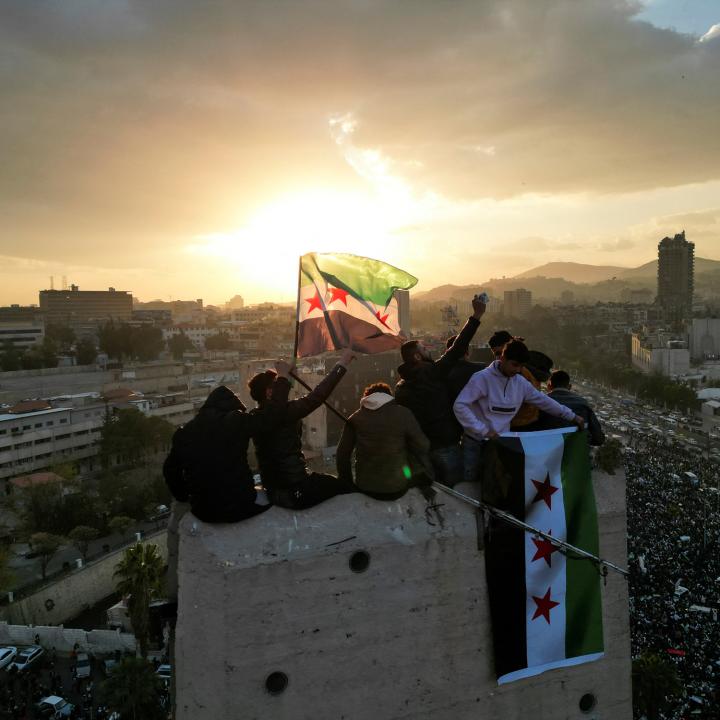 Syrian civilians celebrate the fall of the Assad regime in December 2024 in downtown Damascus - source: Reuters