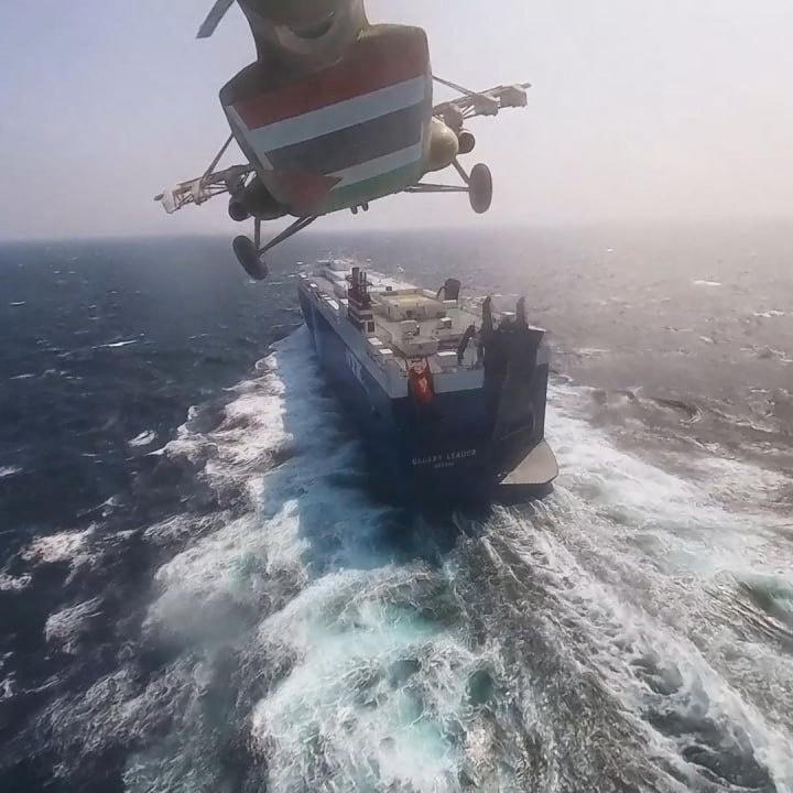 A Houthi helicopter approaches a civilian cargo ship in the Red Sea in 2023 - source: Reuters