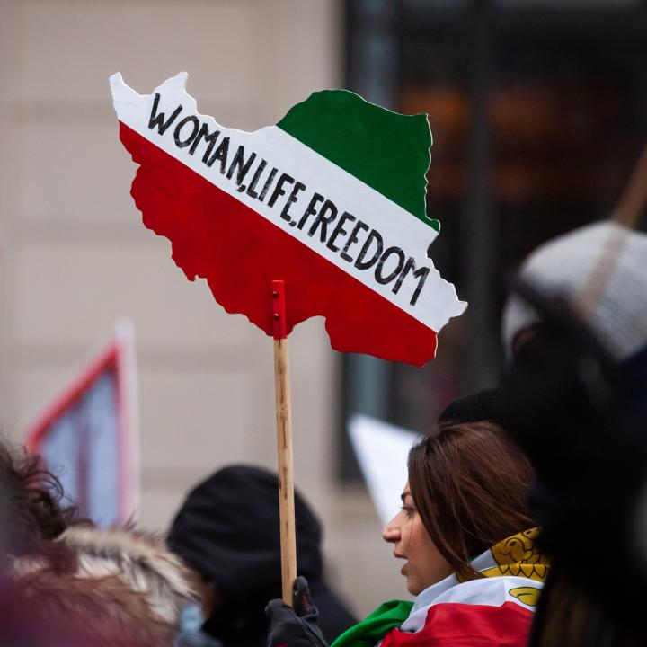 Iranian-American demonstrators hold signs at a protest in Washington, DC - source: Reuters