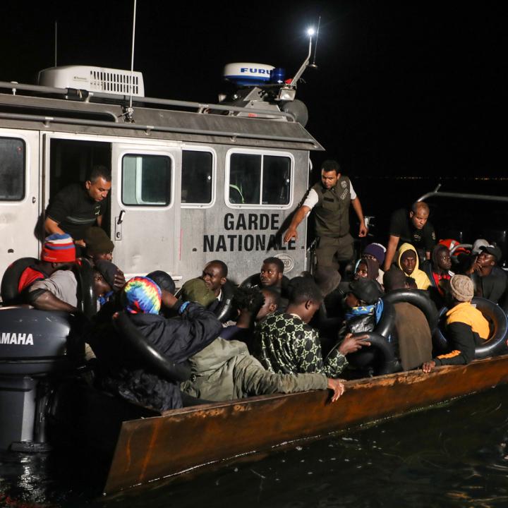 A Tunisian maritime patrol boat intercepts a migrant boat in the Mediterranean - source: Reuters