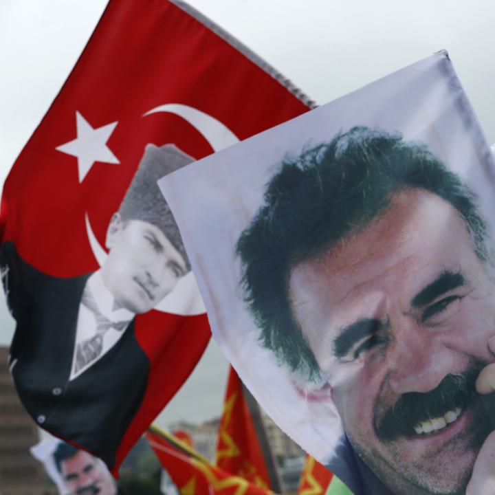 Demonstrators fly a mixture of Turkish flages featuring the image of the Republic of Turkey's founder, Kemal Mustafa Ataturk, and banners depicting Kurdish militia leader Abdullah Ocalan - source: Reuters