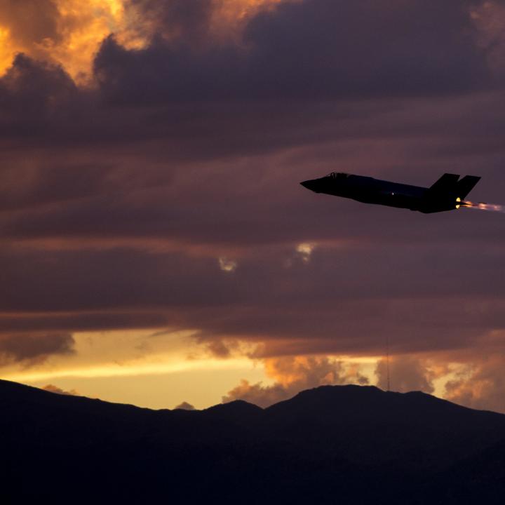 An F35A fighter on a night-training mission at dusk