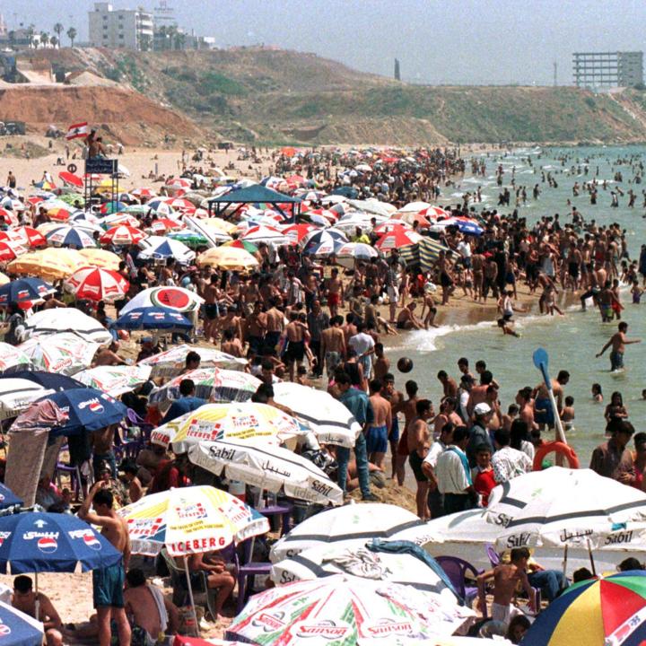 Sunbathers gather on Al-Baida beach in Lebanon - source: Reuters