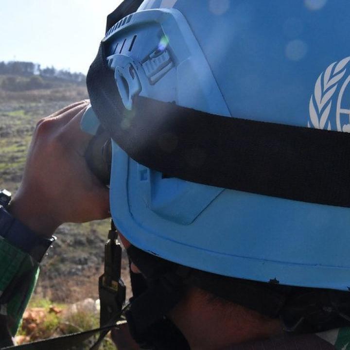 A United Nations peacepeeker scans the terrain in southern Lebanon - source: Untied Nations