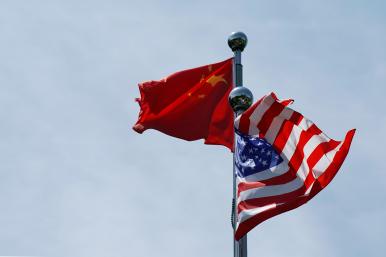 Chinese and U.S. flags flutter at a trade meeting in Shanghai