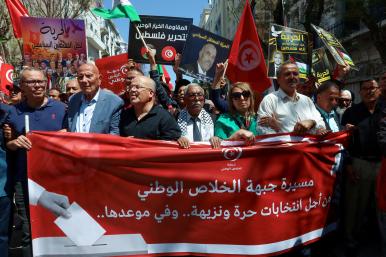 Imed Khemiri, a senior official in the Ennahda party and member of the Salvation Front (L) takes part in a protest, demanding the release of imprisoned journalists, activists, opposition figures and setting a date for fair presidential elections in Tunis, Tunisia May 12, 2024 - source: Reuters