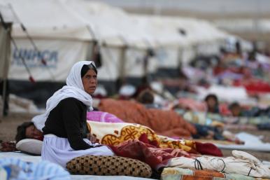 Yezidi women and children at a refugee camp in Iraq - source: Reuters