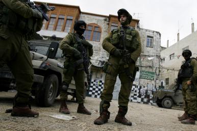 Israeli soldiers on patrol in the West Bank community of Nablus - source: Reuters