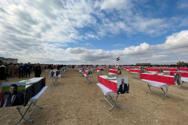 Coffins with the remains of people from the Yazidi minority, who were killed by Islamic State militants, after they were exhumed from a mass grave, before their burial in Kojo, Iraq February 6, 2021 - source: Reuters