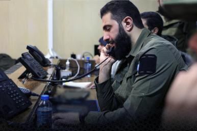 Syrian rebel leader Abu Mohammed al-Jolana speaks on the phone during the campaign to take Damascus in December 2024 - source: Reuters