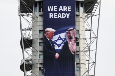 A billboard promoting a regional peace deal hangs in Ramat Gan, Israel, in February 2025 - source: Reuters