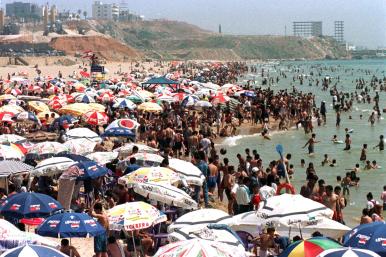 Sunbathers gather on Al-Baida beach in Lebanon - source: Reuters