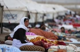 Yezidi women and children at a refugee camp in Iraq - source: Reuters