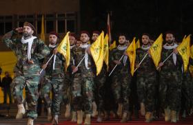 Hezbollah fighters parade with flags in Lebanon in 2019 - source: Reuters