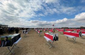 Coffins with the remains of people from the Yazidi minority, who were killed by Islamic State militants, after they were exhumed from a mass grave, before their burial in Kojo, Iraq February 6, 2021 - source: Reuters